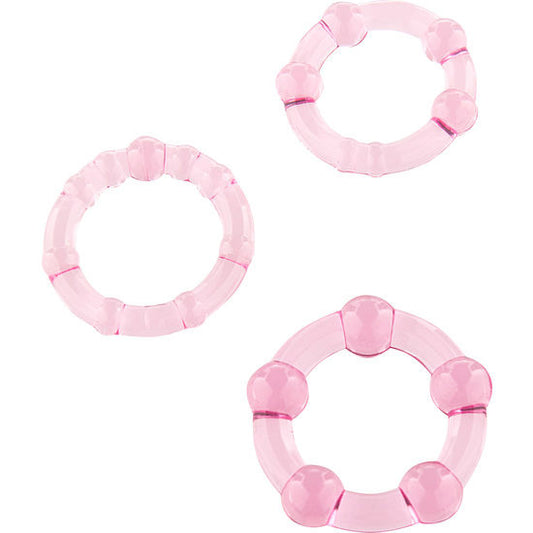 Conjunto Triple Loop Seven Creations: Os três anéis penianos em silicone rosa exibidos lado a lado em perspetiva de tamanhos progressivos.