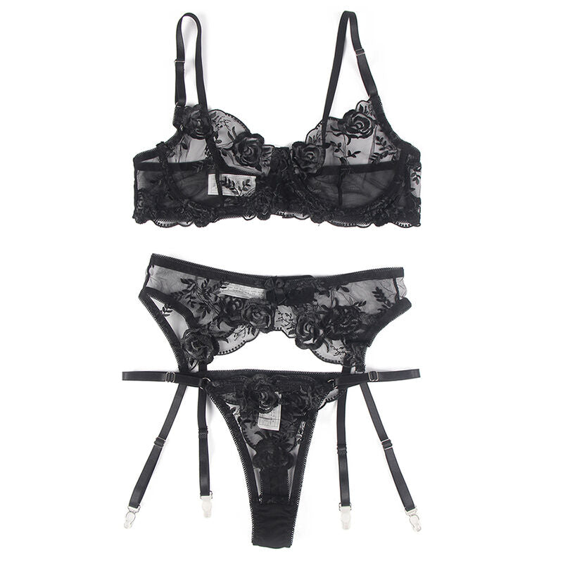 Conjunto de 3 Peças Subblime Floral: Set coordenado de sutiã, cinta-ligas e tanga com estampa botânica sobre fundo preto. Diamora