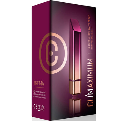 Vibrador de batom prateado Trema da Diamora, posicionado ao lado de maquilhagem para mostrar discrição.