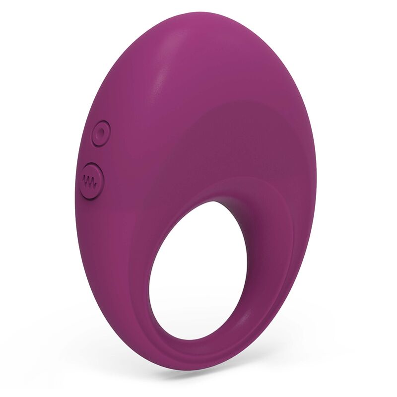 Ergonomia do Silicone: Detalhe macro da aba superior texturizada do anel, projetada para a estimulação clitoridiana sincronizada.