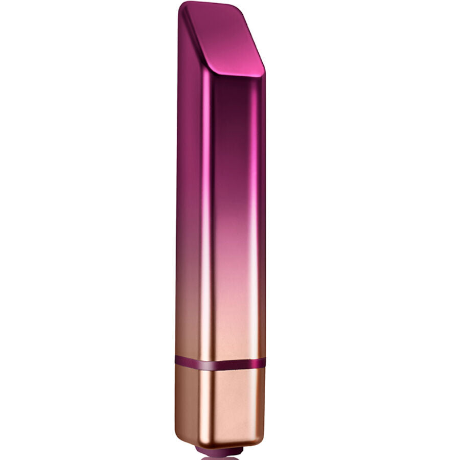 Vibrador de batom prateado Trema da Diamora, posicionado ao lado de maquilhagem para mostrar discrição.